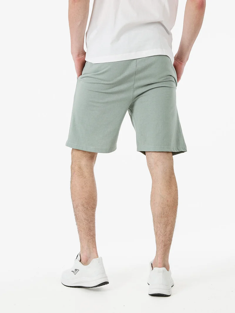 Bermuda sportivi da uomo in misto cotone con coulisse e logo - pistacchio