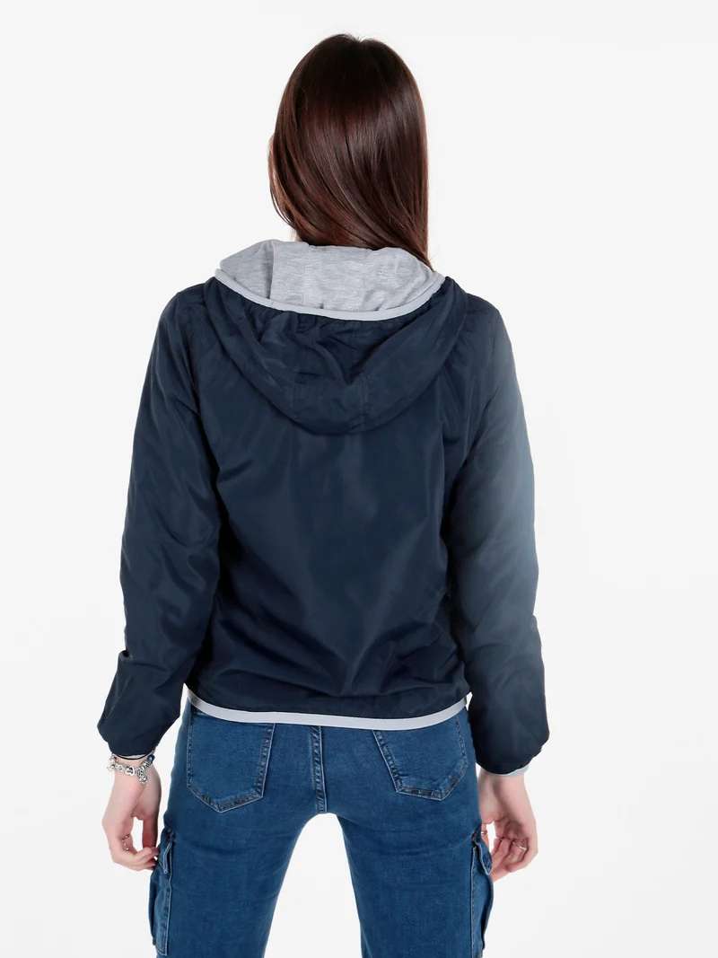 Giacca a vento da donna reversibile con cappuccio - blu scuro