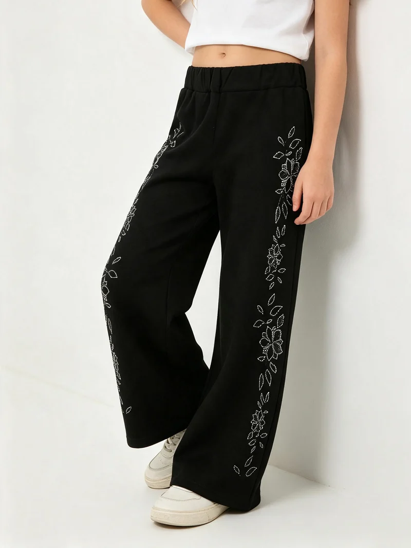 Pantaloni da bambina a gamba larga con strass floreali - nero