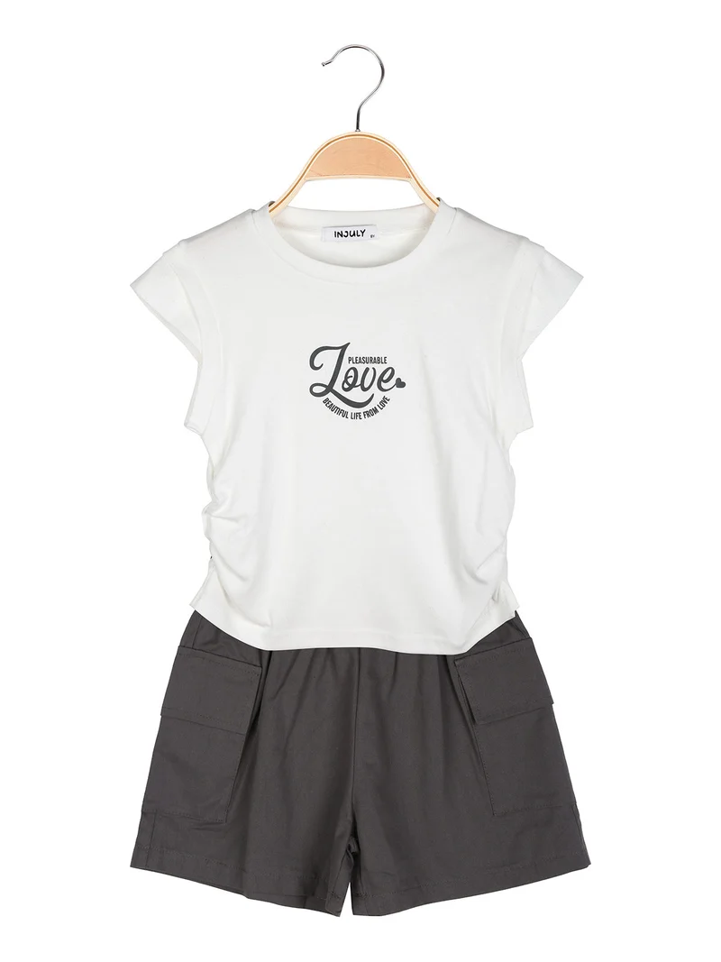 Completo corto da bambina con t-shirt e shorts con tasconi laterali - nero