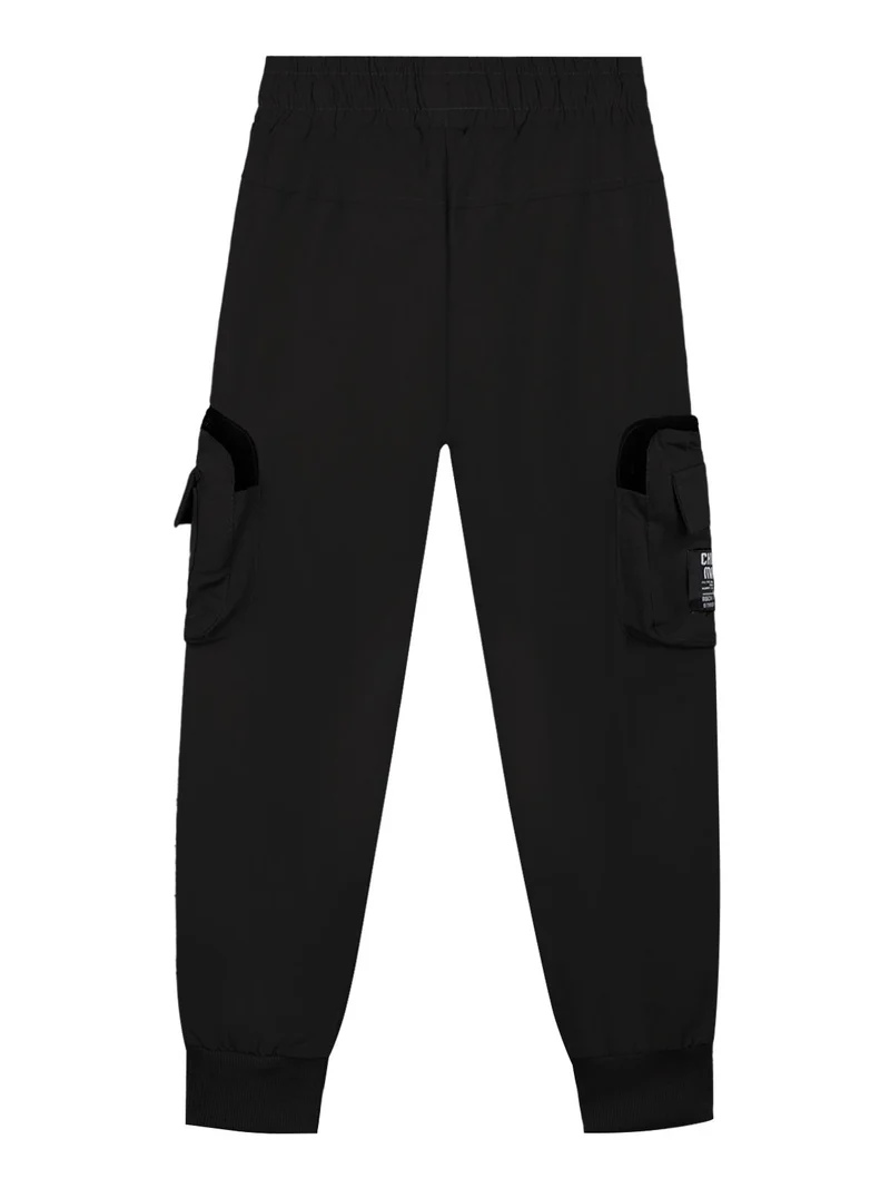 Pantaloni da bambino con tasconi e polsini alle caviglie - nero