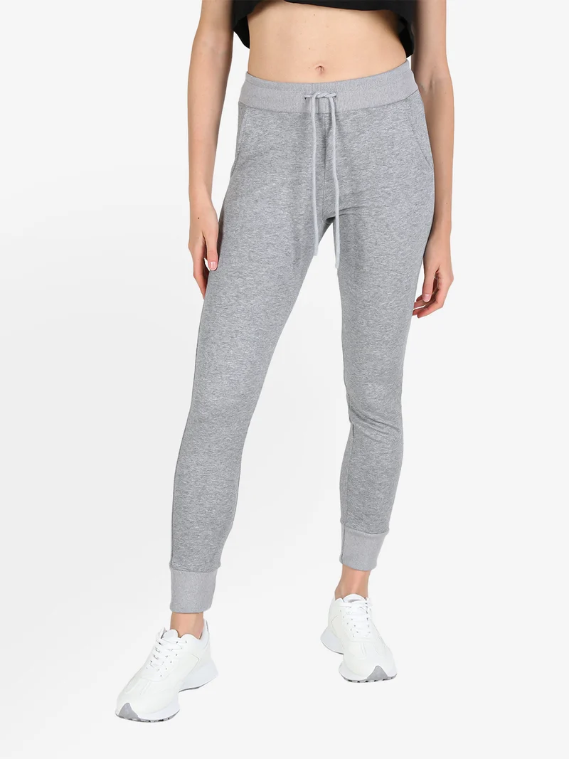 Pantaloni tuta da donna con coulisse e polsini - grigio