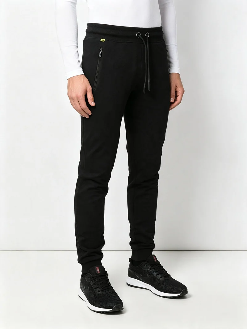 Pantaloni sportivi da uomo in cotone con coulisse e polsini - nero