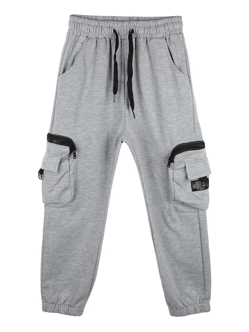 Pantaloni tuta da bambino con tasconi laterali e polsini - grigio