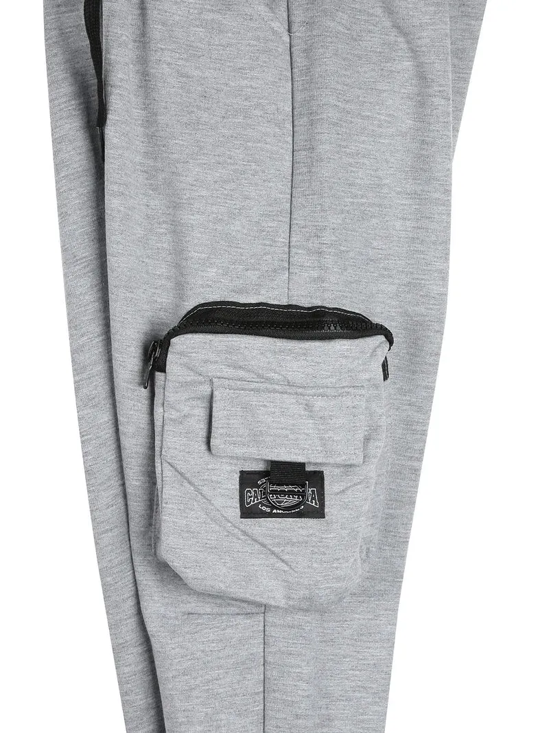 Pantaloni tuta da bambino con tasconi laterali e polsini - grigio