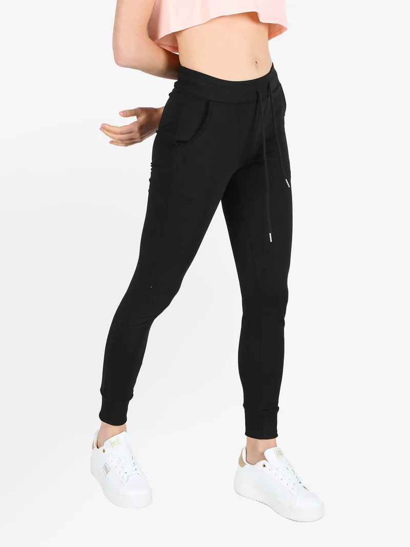 Pantaloni tuta da donna con coulisse e polsini - nero