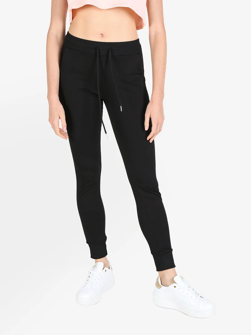 Pantaloni tuta da donna con coulisse e polsini - nero