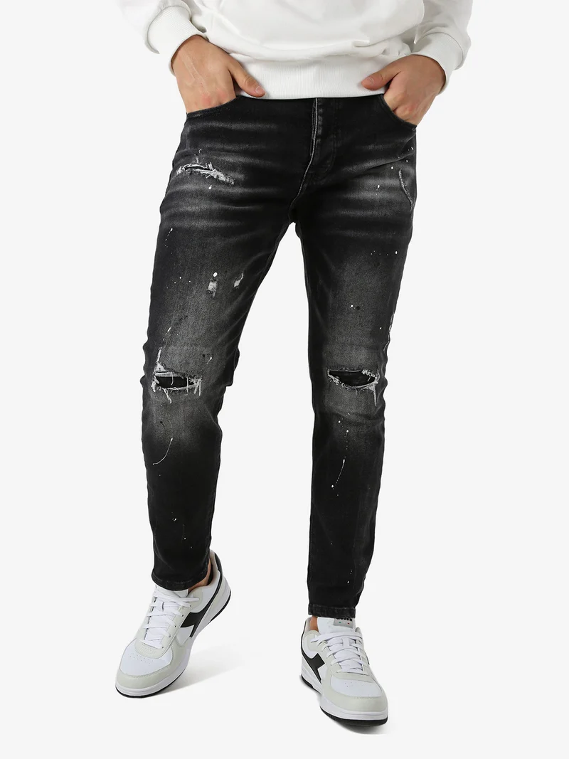 Jeans skinny da uomo con strappi - nero