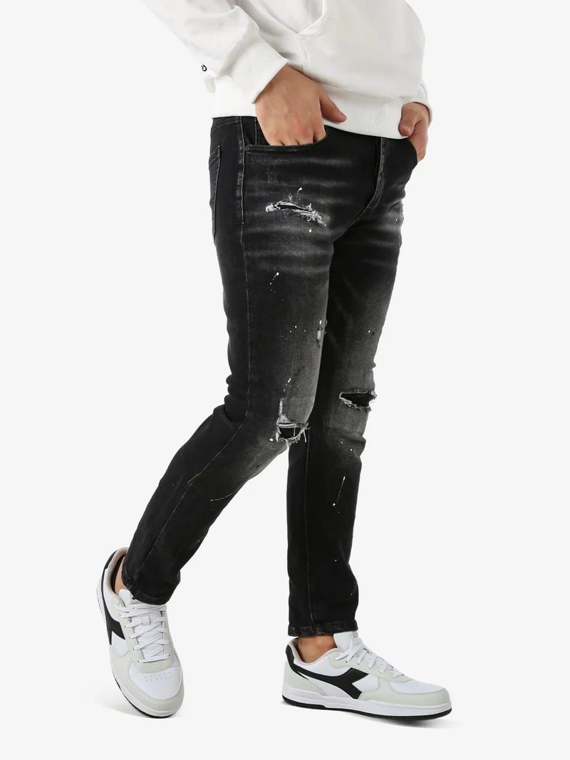Jeans skinny da uomo con strappi - nero