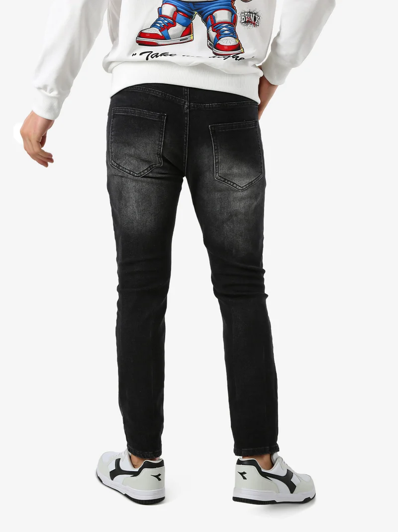 Jeans skinny da uomo con strappi - nero