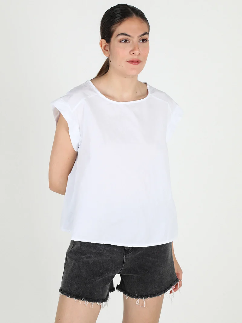 Blusa donna in cotone con bottoni laterali - bianco