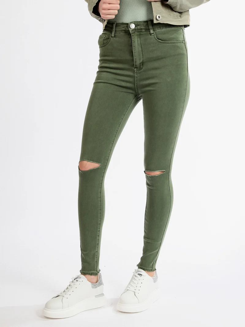 Pantaloni donna elasticizzati con strappi - verde