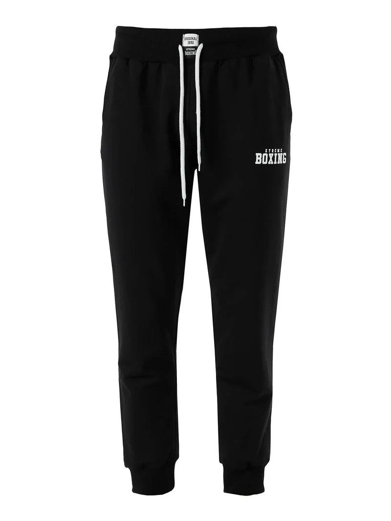 Pantaloni sportivi da uomo in cotone con coulisse e polsini - nero