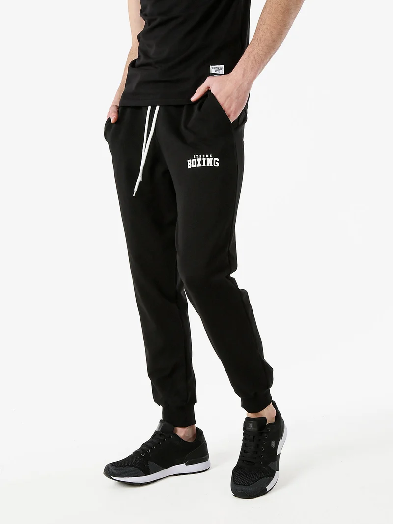 Pantaloni sportivi da uomo in cotone con coulisse e polsini - nero