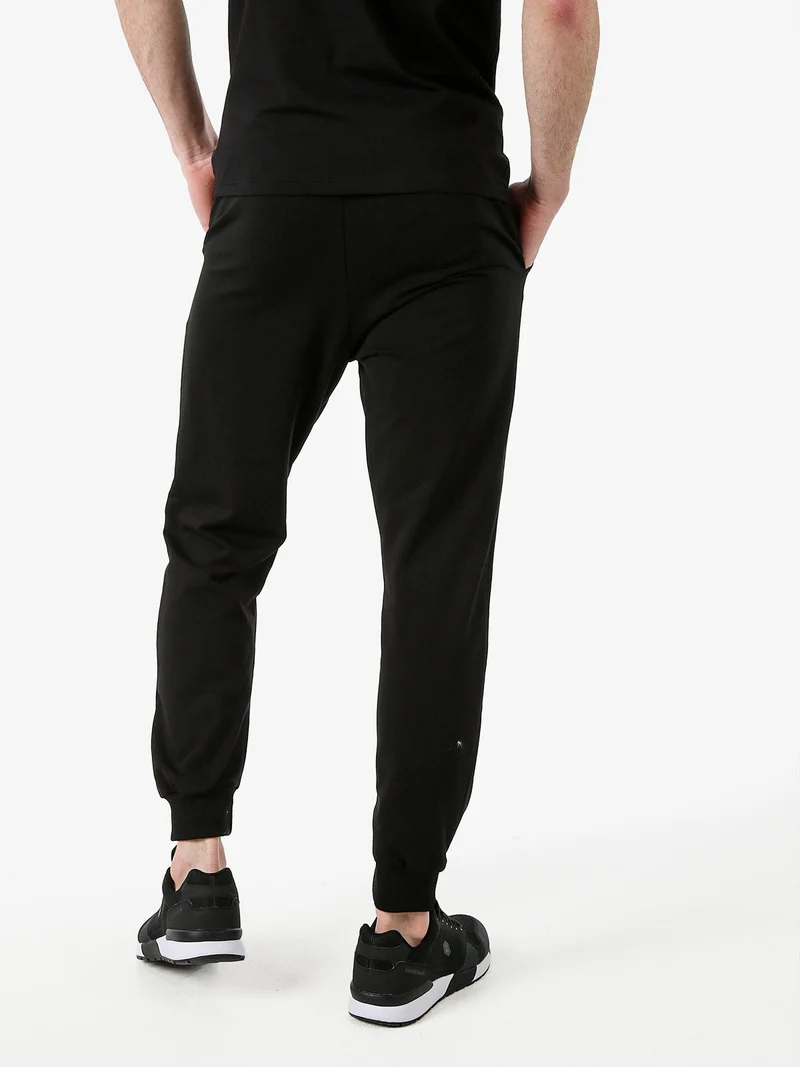 Pantaloni sportivi da uomo in cotone con coulisse e polsini - nero
