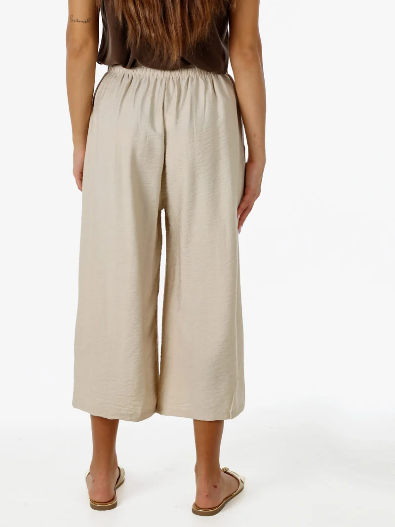 Pantaloni donna cropped a gamba larga con coulisse - beige