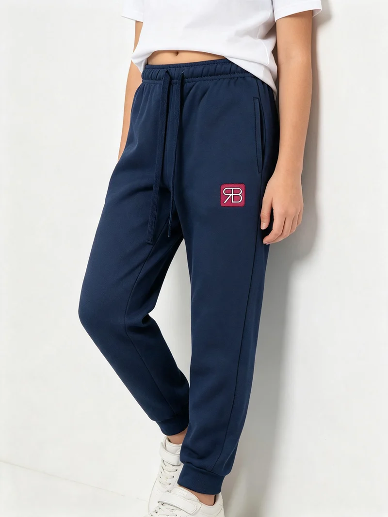 Pantaloni tuta felpati da bambina - fucsia