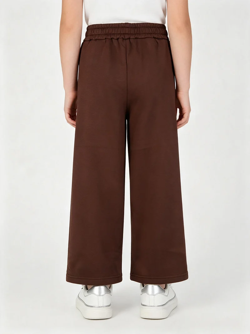 Pantaloni da bambina con mircro borchie e interno felpato - moro