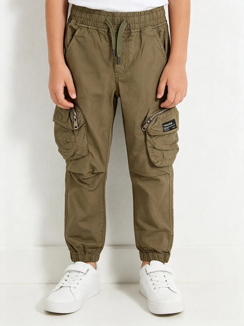 Pantaloni cargo da ragazzo con elastico finale - militare