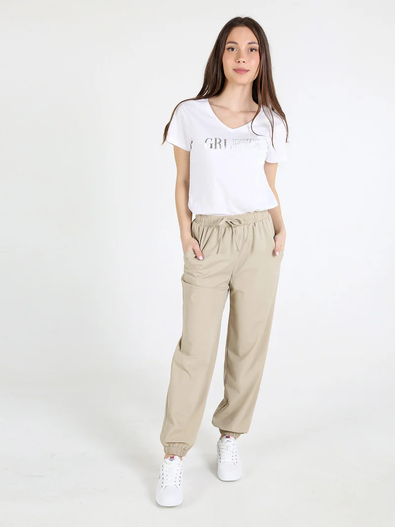Pantaloni donna in tessuto tecnico con polsini - sabbia