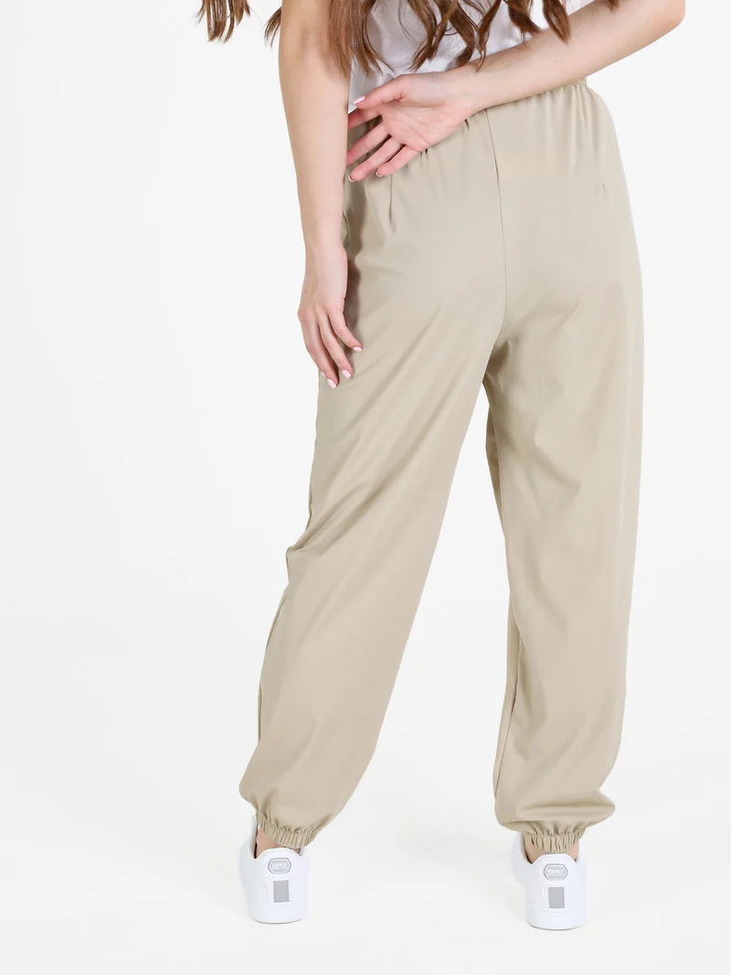 Pantaloni donna in tessuto tecnico con polsini - sabbia
