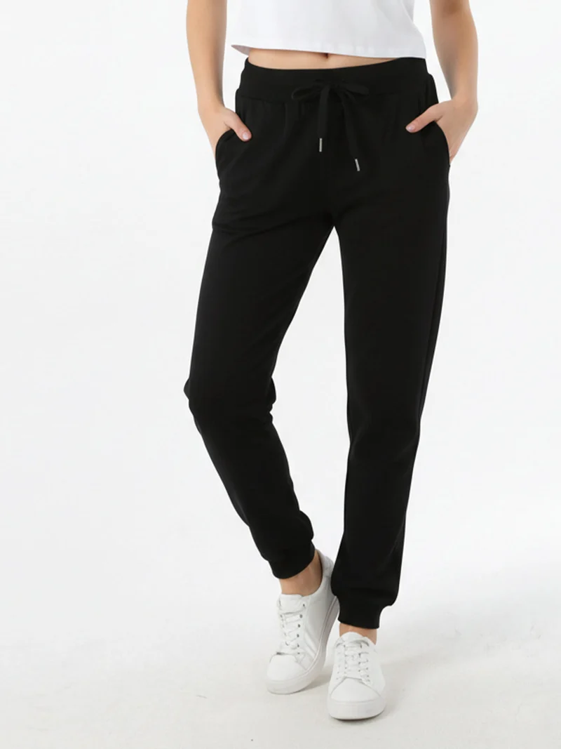 Pantaloni tuta da donna con coulisse e polsini - nero