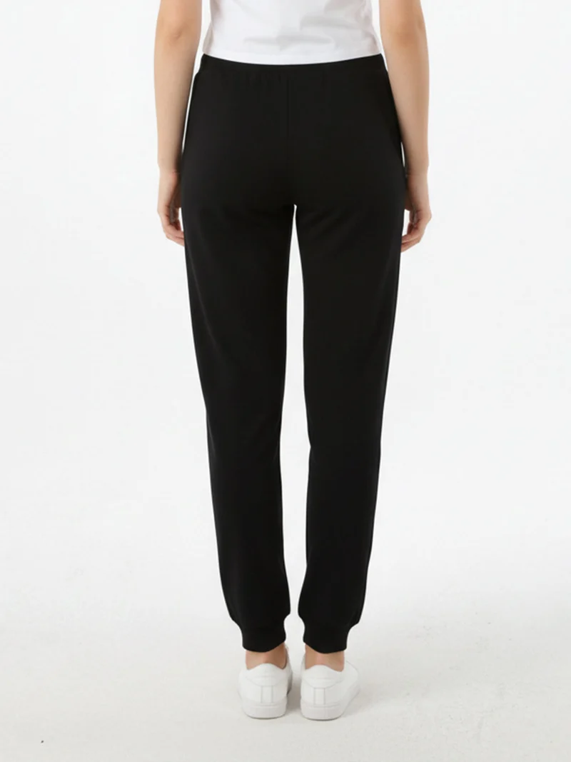 Pantaloni tuta da donna con coulisse e polsini - nero
