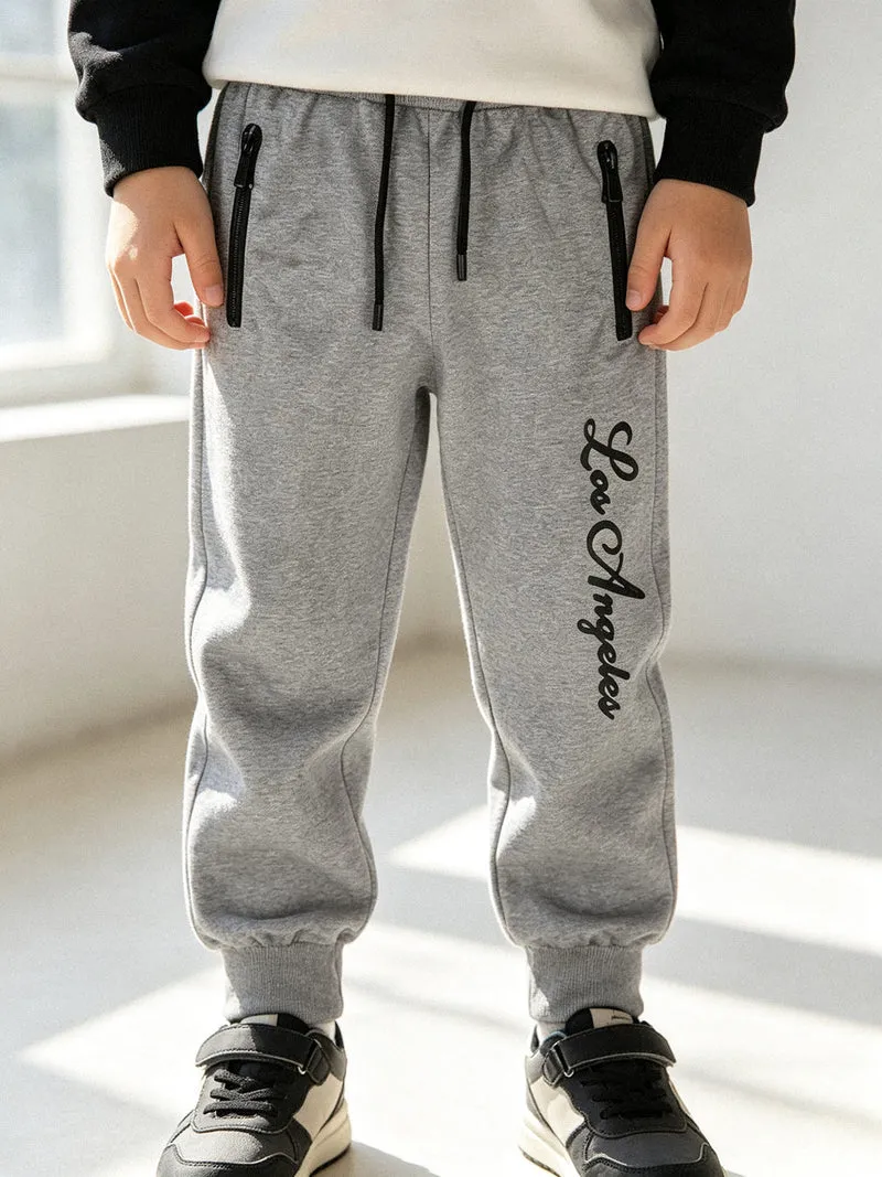 Pantaloni tuta da bambino con polsini e coulisse - grigio