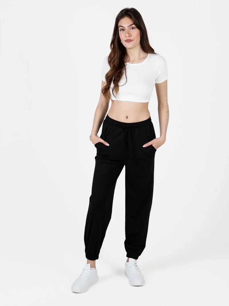 Pantaloni donna in tessuto tecnico con polsini - nero