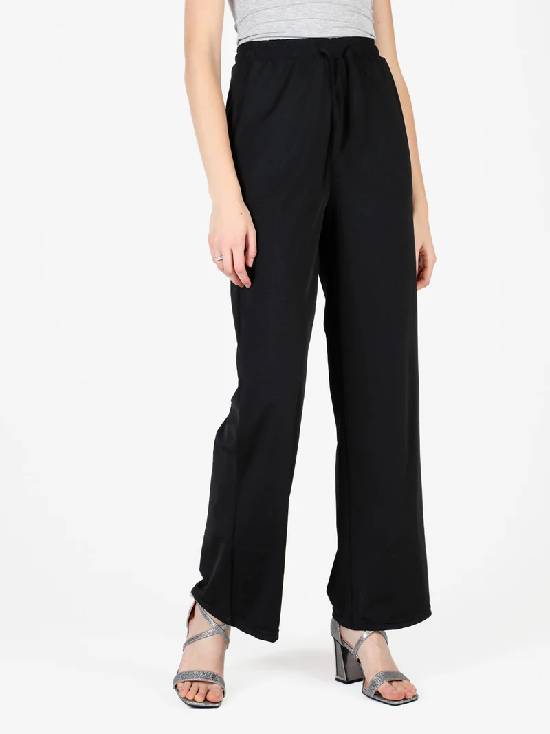 Pantaloni donna in tessuto tecnico a gamba larga - nero
