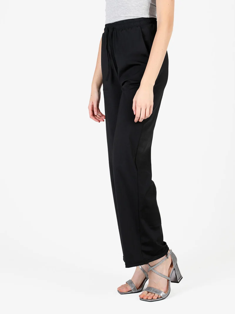 Pantaloni donna in tessuto tecnico a gamba larga - nero