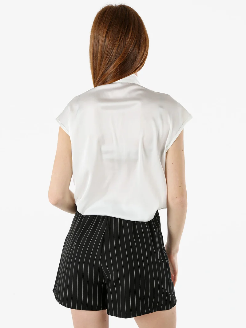 Blusa donna senza maniche con scollo a V profondo - bianco