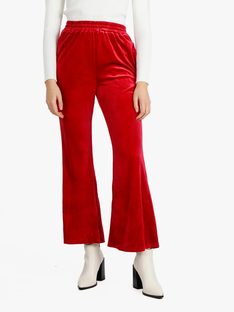 Pantaloni a zampa da donna in velluto - rosso