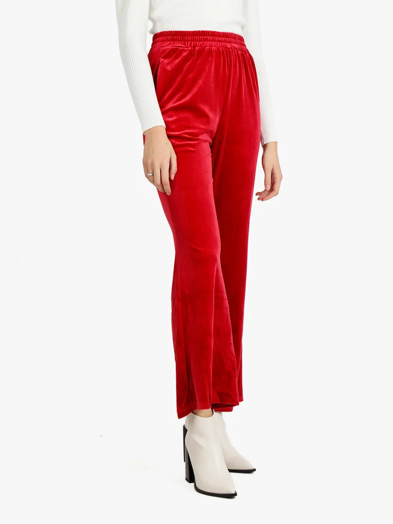 Pantaloni a zampa da donna in velluto - rosso