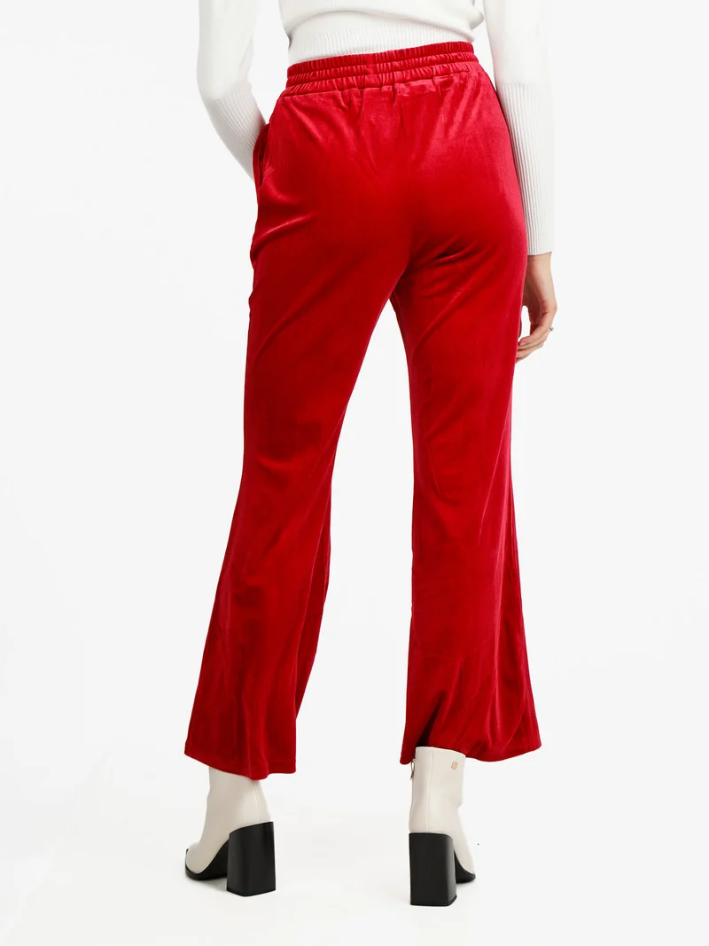 Pantaloni a zampa da donna in velluto - rosso