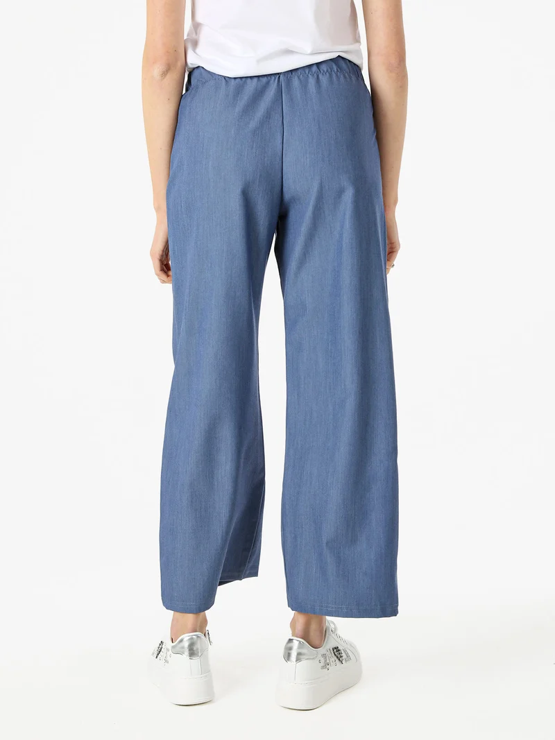 Pantaloni da donna a gamba larga con logo di strass - blu