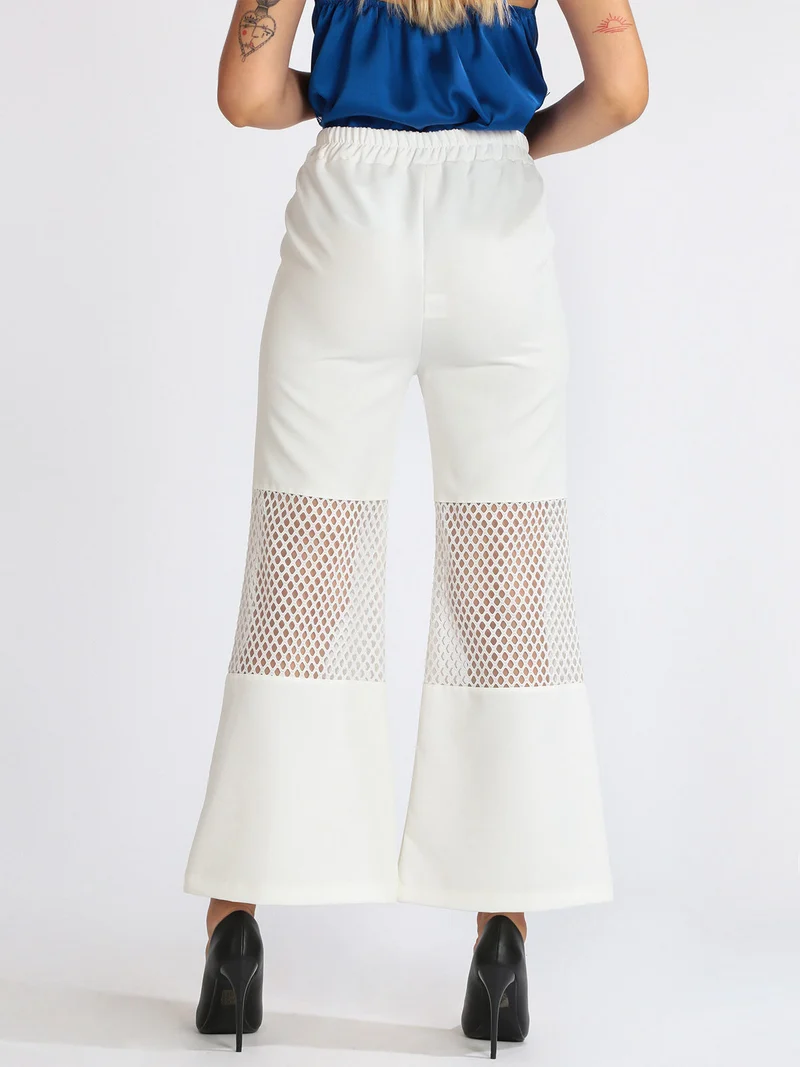 Pantaloni donna a zampa con dettaglio a rete - bianco