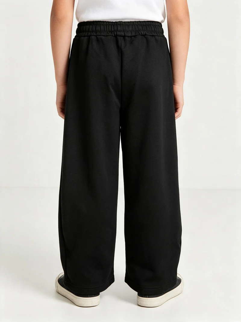 Pantaloni tuta da ragazzo in felpa con coulisse e interno felpato - nero