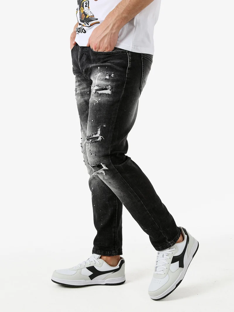 Jeans skinny da uomo con strappi - nero
