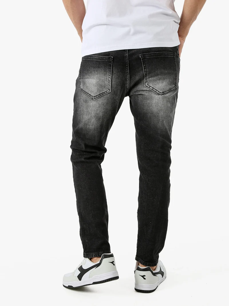 Jeans skinny da uomo con strappi - nero