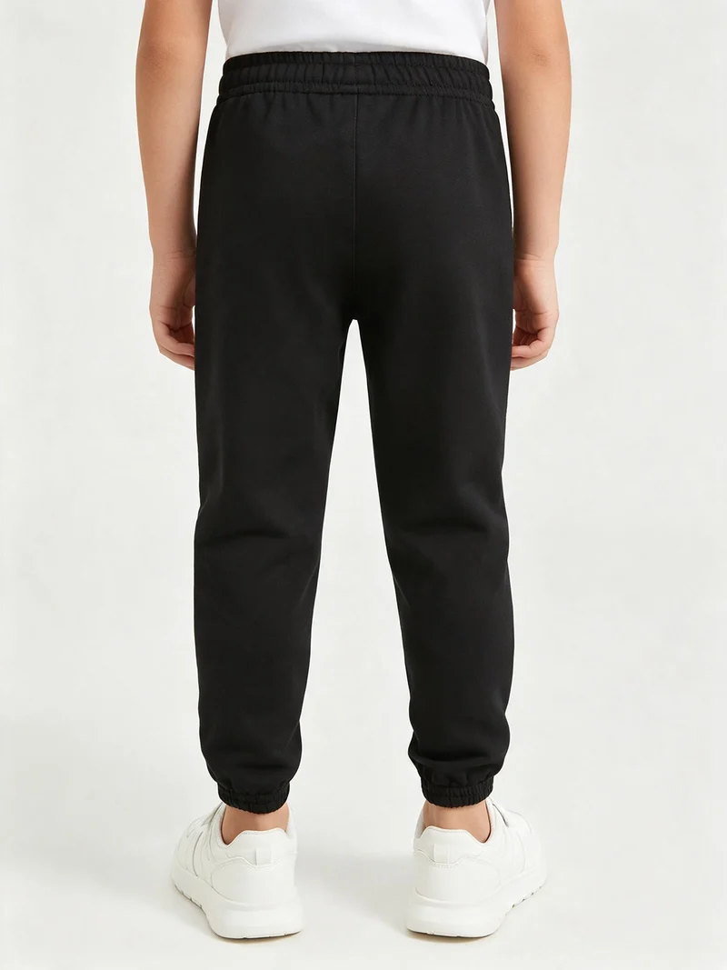 Pantaloni tuta da ragazzi con interno in caldo cotone - nero