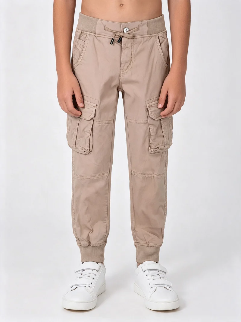 Pantaloni da ragazzo con tasconi laterali e polsini - khaki
