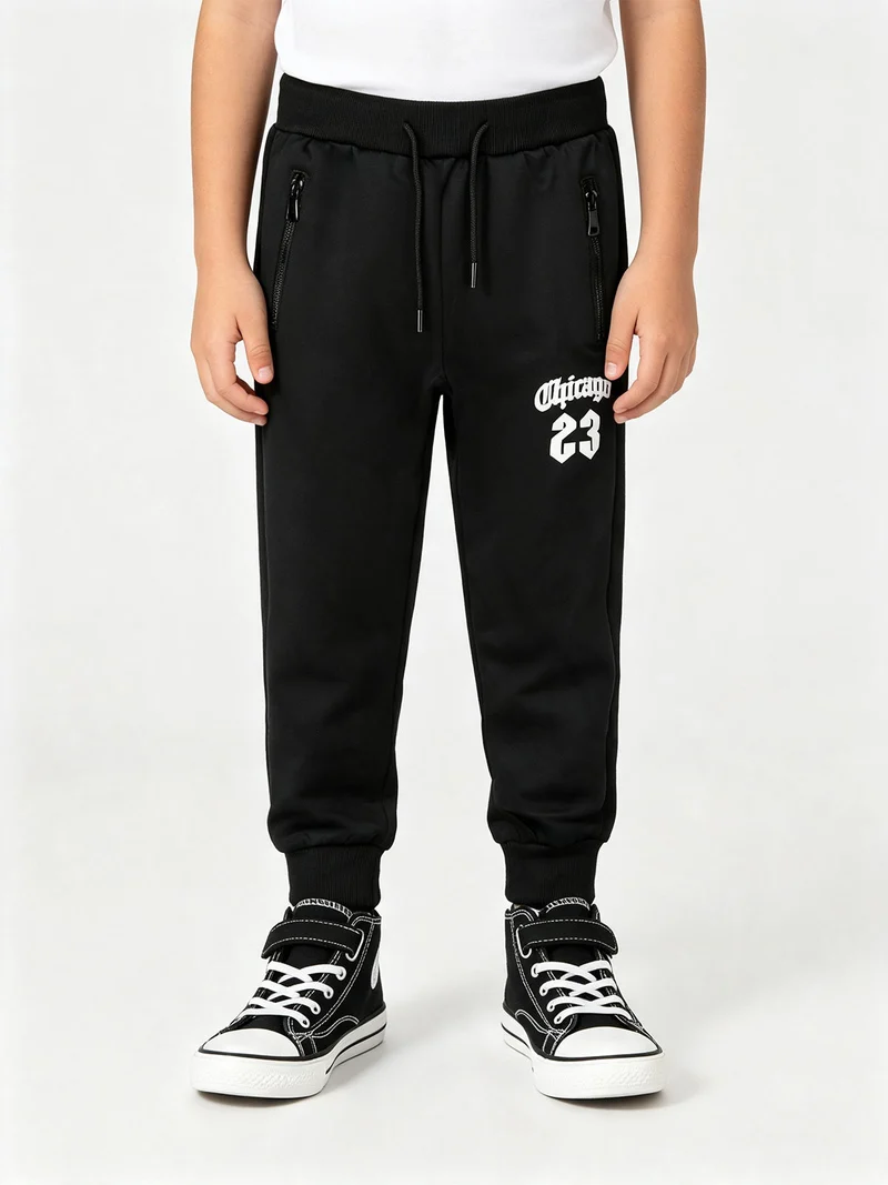 Pantaloni tuta da bambino con coulisse e polsini - nero
