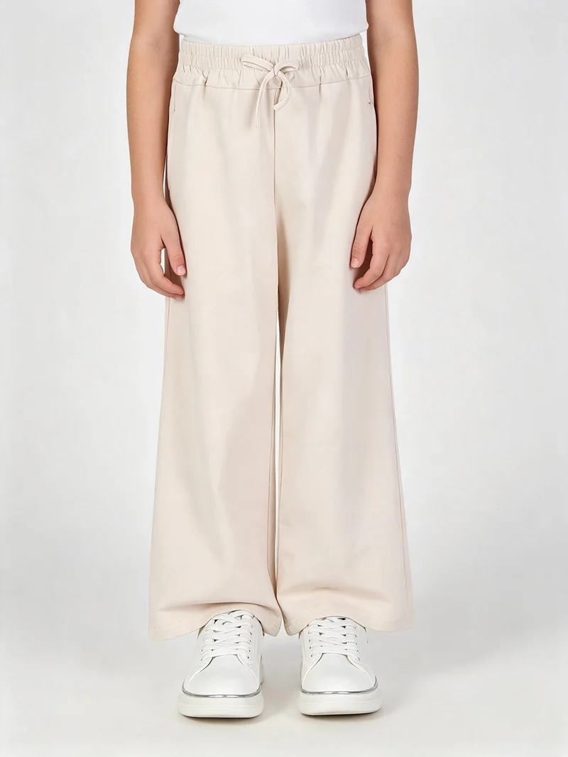 Pantaloni da bambina in cotone a vita alta - beige