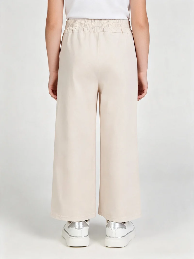 Pantaloni da bambina in cotone a vita alta - beige