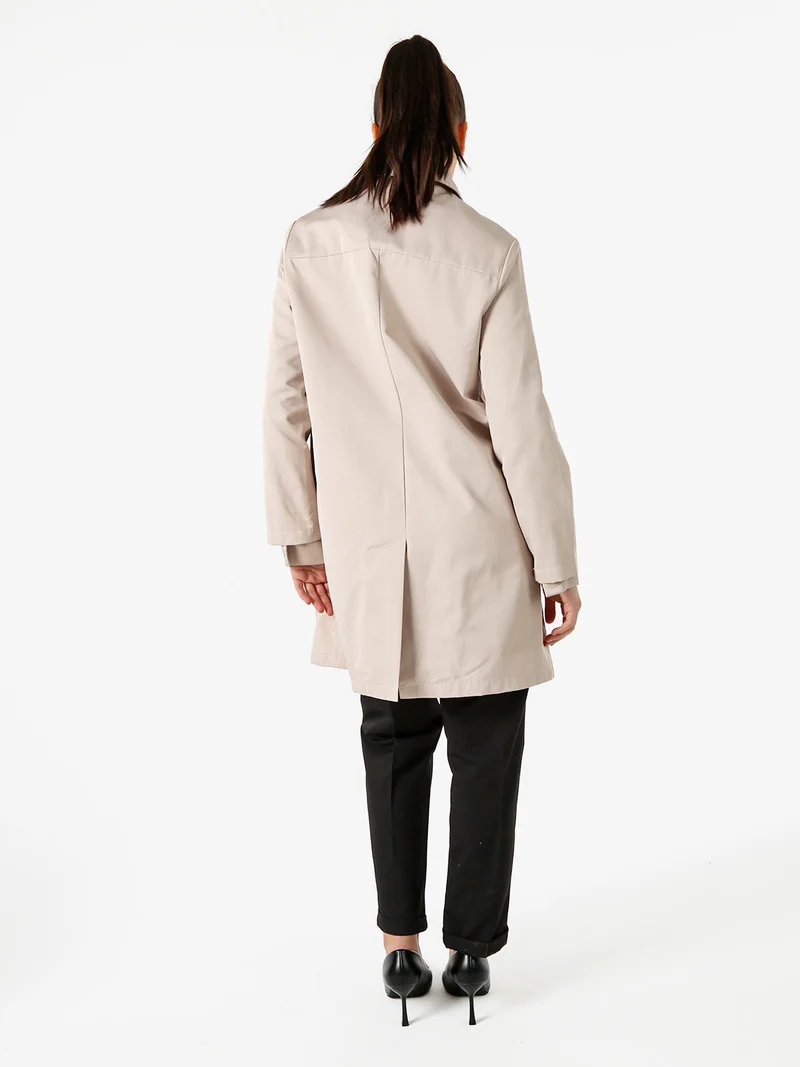 Trench impermeabile da donna con bottoni - beige