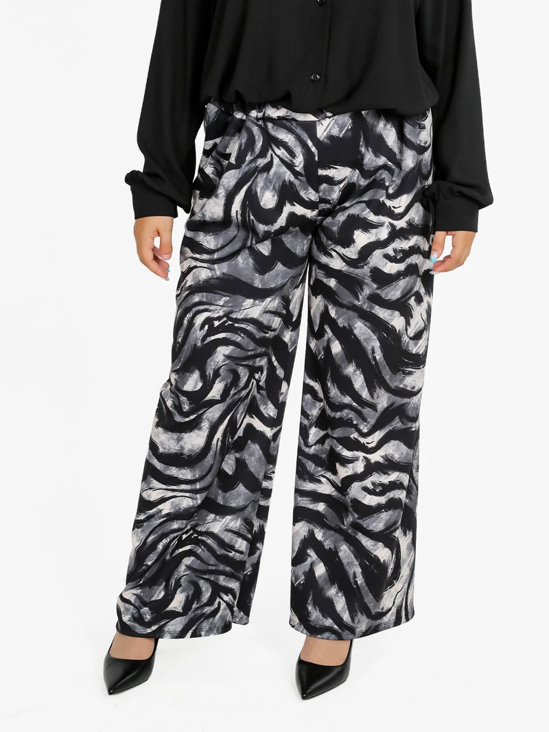 Pantaloni donna a gamba larga con stampa fantasia - grigio