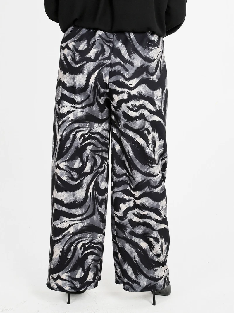 Pantaloni donna a gamba larga con stampa fantasia - grigio