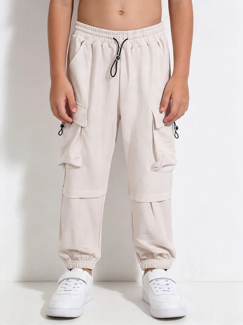 Pantaloni da bambino con tasconi e polsini - beige