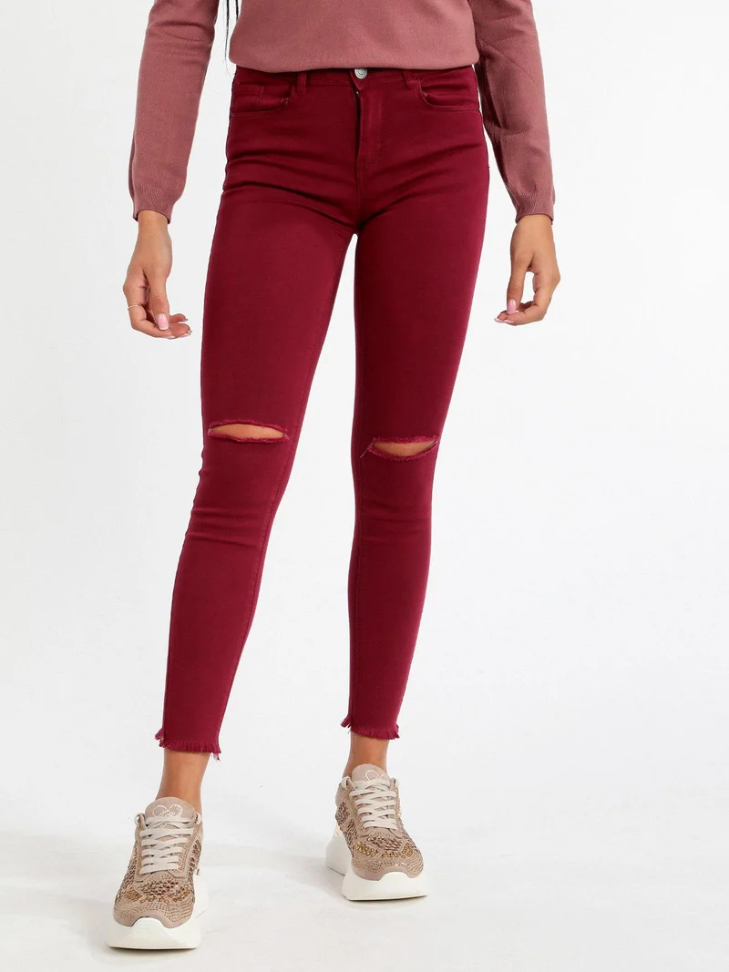 Pantaloni donna skinny con strappi - bordeaux